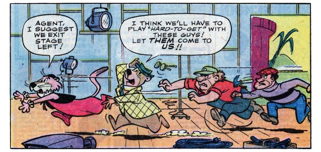 A panel from this issue showing two guys chasing Snagglepuss the lion and Yogi Bear through a television studio. Snagglepuss says, “Agent, I suggest we exit stage left!” Yogi says, “I think we’ll have to play ‘hard-to-get’ with these guys! Let them come to us!!” A panel from this issue showing two guys chasing Snagglepuss the lion and Yogi Bear through a television studio. Snagglepuss says, “Agent, I suggest we exit stage left!” Yogi says, “I think we’ll have to play ‘hard-to-get’ with these guys! Let them come to us!!”